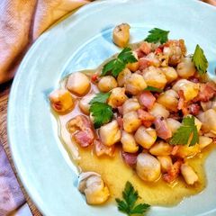 A picture of Manx Queenies & Smoked Bacon In A Garlic Butter Sauce.