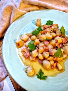 A picture of Manx Queenies & Smoked Bacon In A Garlic Butter Sauce.