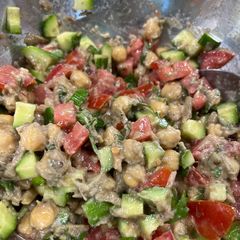 A picture of Eggplant 🍆 with Tahini and Chickpeas.