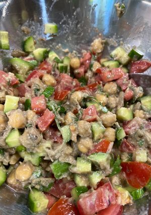 A picture of Eggplant 🍆 with Tahini and Chickpeas.