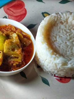 A picture of Scooped Rice and Garden Egg Sauce.