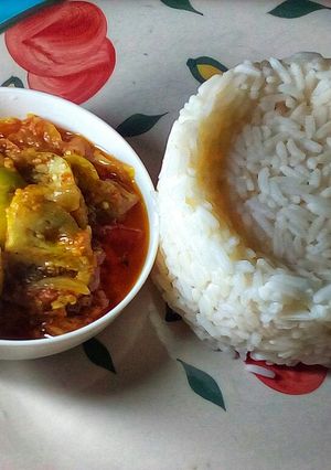 A picture of Scooped Rice and Garden Egg Sauce.
