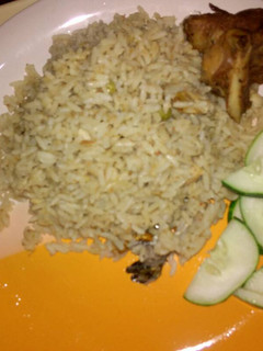 A picture of Coconut rice with turkey and cucumber.
