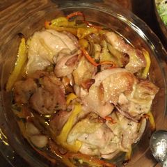 A picture of Simple roast chicken and red and yellow pepper traybake.