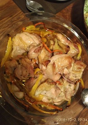 A picture of Simple roast chicken and red and yellow pepper traybake.