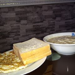 A picture of Omelette, bread and oats.