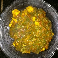 Palak paneer in red gravy A picture of Palak paneer in red gravy.