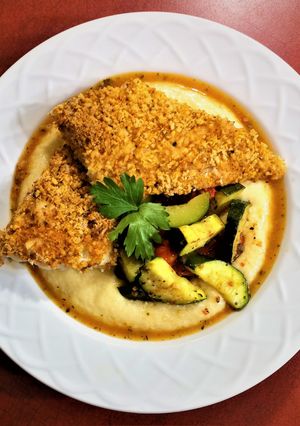 A picture of Oven Fried Fish and Grits.