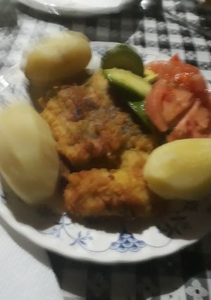 Una foto de Merluza adobada al curry