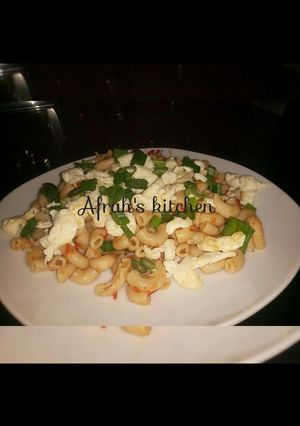A picture of Jollof macaroni and scrambled eggs.