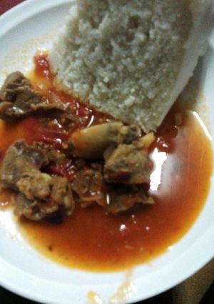 A picture of Beef stew and ugali.