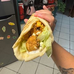 A picture of Chicken Shawarma with homemade garlic herb yoghurt sauce.