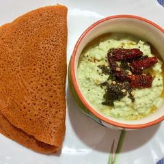 A picture of Carrot dosa & raw mango chutney.