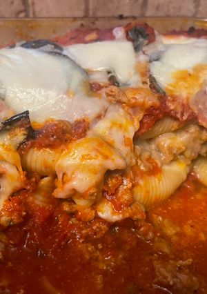 A picture of The best stuffed shells ever- using homemade garlic ricotta.