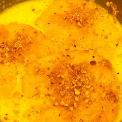 A picture of Pall Puri/poli –puries soaked in sweetened milk.