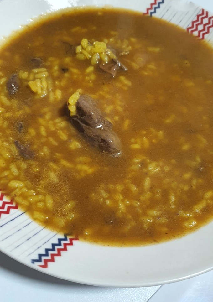 Una foto de Arroz con higaditos de pollo