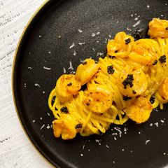 Creamy curry prawn spaghetti with Beluga caviar A picture of Creamy curry prawn spaghetti with Beluga caviar.