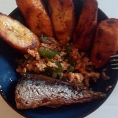 A picture of Plantain, egg sauce and fish.