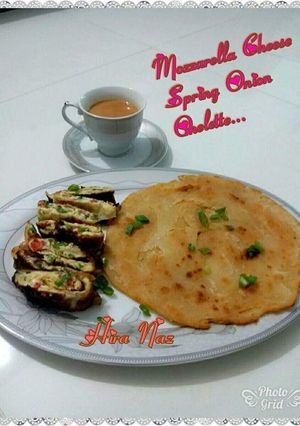 A picture of Paratha With Mozzarella Cheese Spring Onion Omelette.