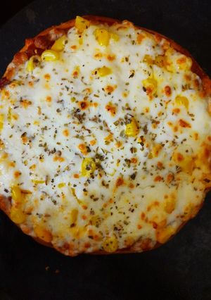 A picture of Cheese and corn pizza.
