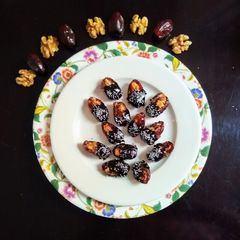 A picture of Walnuts in Dates Dipped In Chocolate.