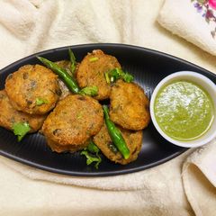 A picture of Grated Potato Fritters with Green Chutney.
