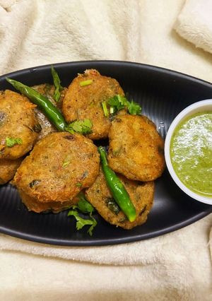 A picture of Grated Potato Fritters with Green Chutney.