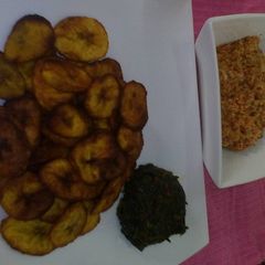 A picture of Fried plantain with egg sauce and vegetable.