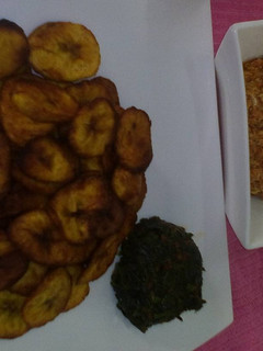 A picture of Fried plantain with egg sauce and vegetable.