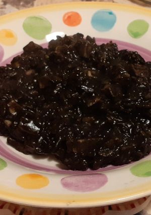 Foto di Risotto al nero di seppia e totani