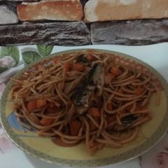 A picture of Carrot spaghetti jollof with sardines.