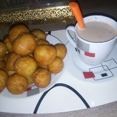 Simple breakfast puff puff and hot tea A picture of Simple breakfast puff puff and hot tea.