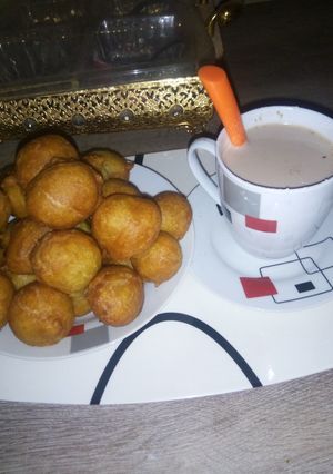 A picture of Simple breakfast puff puff and hot tea.