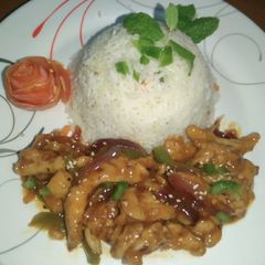 A picture of Dragon chicken with Garlic Rice.