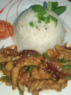 A picture of Dragon chicken with Garlic Rice.
