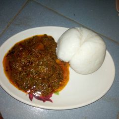 A picture of Maize swallow with egusi soup.