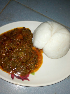 A picture of Maize swallow with egusi soup.
