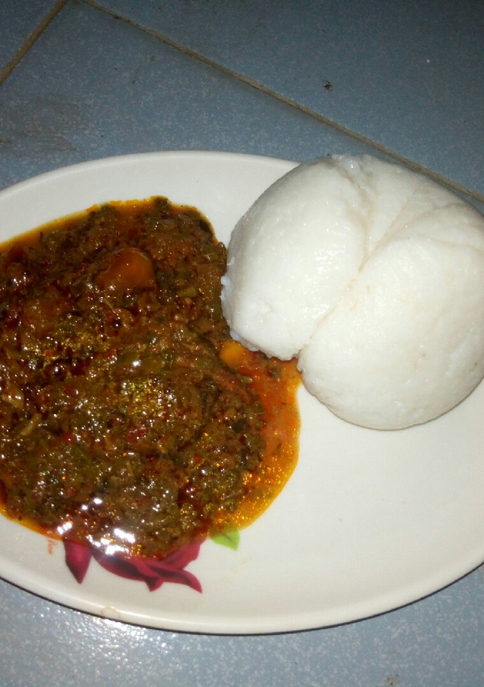 A picture of Maize swallow with egusi soup.