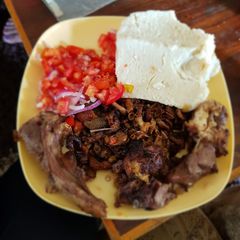 A picture of Meat mix with Ugali.