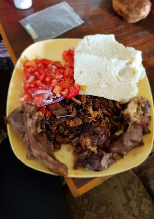 A picture of Meat mix with Ugali.