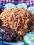 Cucumber jollof rice and fried fish