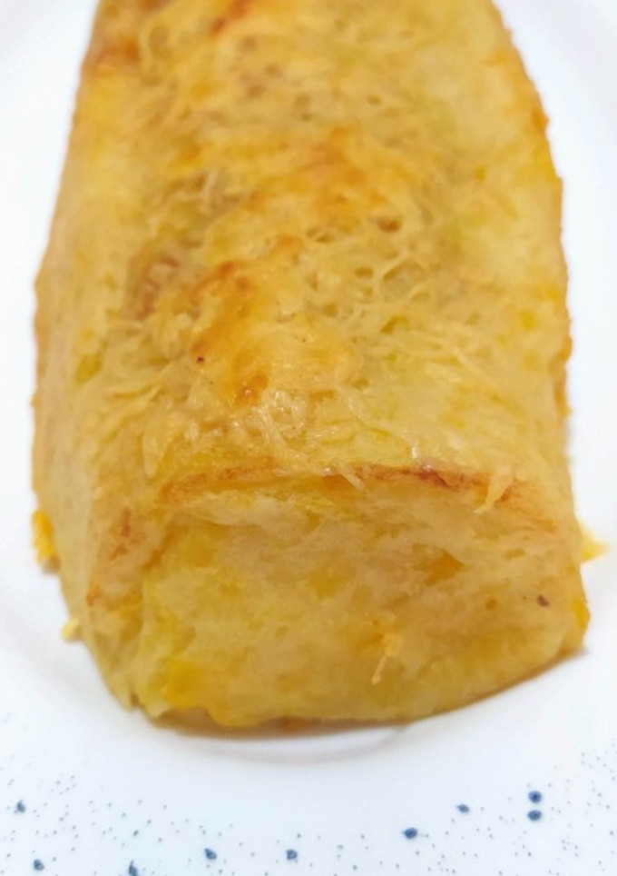Una foto de Rulo de patata rellena y gratinada