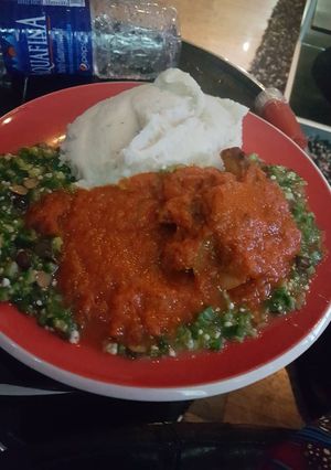A picture of Okro soup with buka stew and semo.