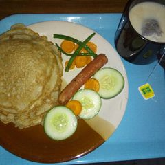 A picture of Fluffy pancakes with steamed veggies.