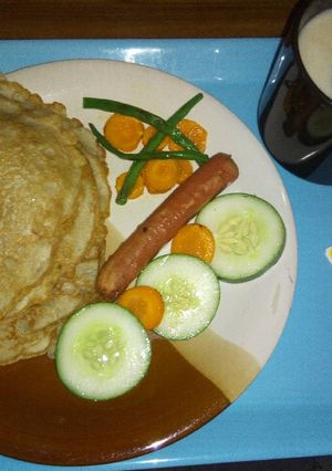 A picture of Fluffy pancakes with steamed veggies.