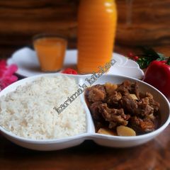 A picture of White rice and lamb peppersoup.