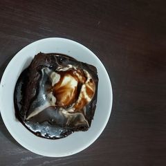 A picture of Hot chocolate  brownie  with vanilla  icecream.