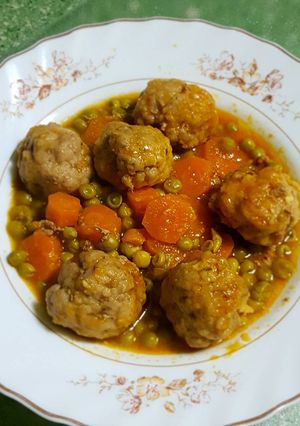 A picture of Meatballs with Peas and Carrots in a Pressure Cooker.