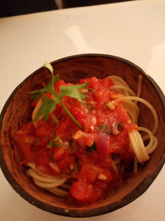 A picture of Spaghetti with tomatoe sauce.