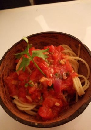 A picture of Spaghetti with tomatoe sauce.